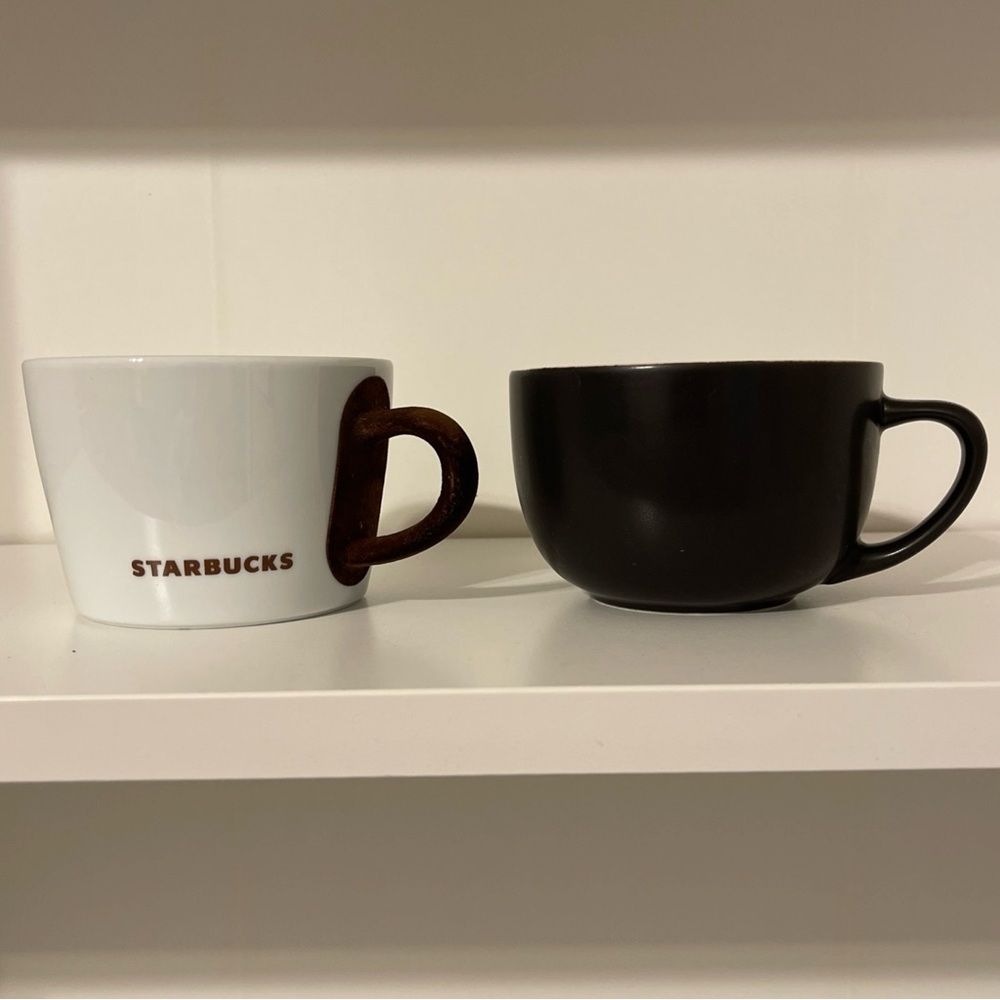Set Of Two Starbucks Mugs.  White W/ Suede Handle, Dark Brown W/flower Inside